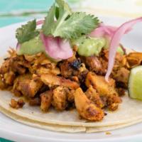 Pollo · Grilled achiote-marinated chicken thighs, avocado salsa, pickled red onions and cilantro.