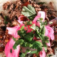 Beyond Taco (Vegan) · Beyond meat, tomatillo arbol salsa, cumin, pickled onion, garlic and cilantro.