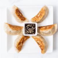 Sweet Potato Potstickers · Potstickers filled with sweet potato, fresh garlic, and fresh ginger. Pan fried and served w...