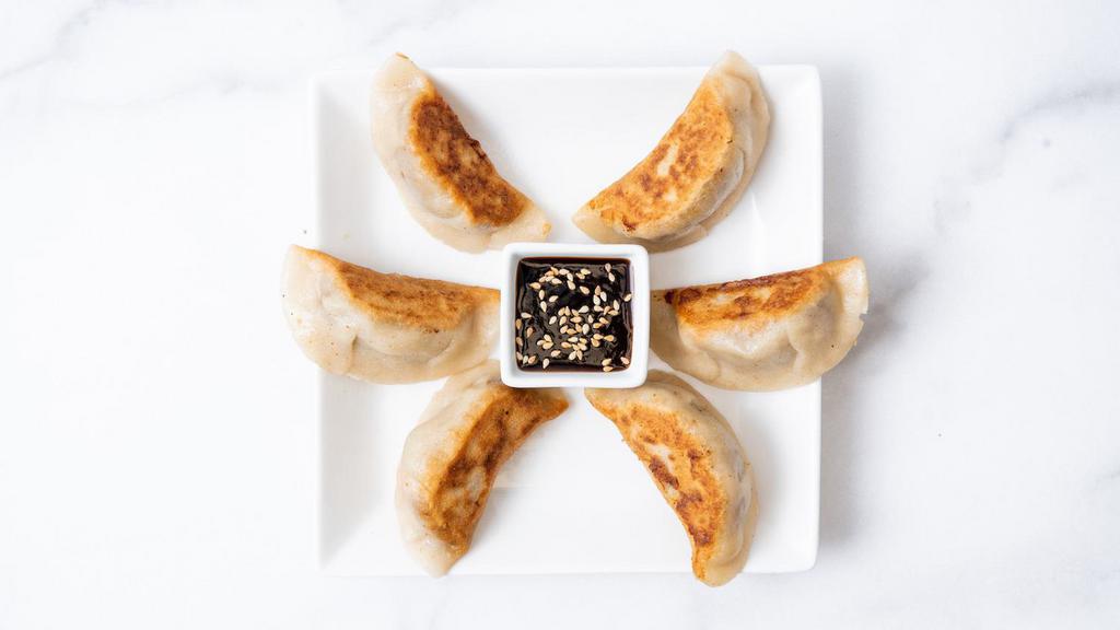 Sweet Potato Potstickers · Potstickers filled with sweet potato, fresh garlic, and fresh ginger. Pan fried and served with our house-made ginger garlic sauce. 5 per order. (Gluten-Free & Vegan)