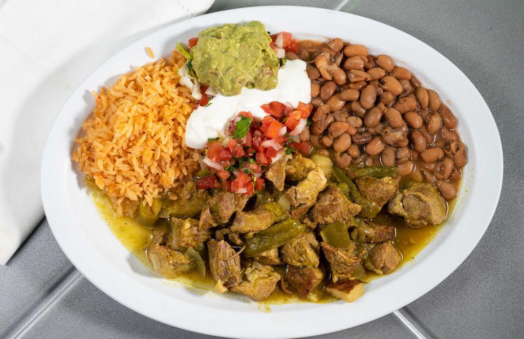 Chili Verde Platter · Cubed Pork simmered and coooked in a tomatillo Sauce, Onions and Green Peppers accompanied by Rice, Beans, Sour cream, Salsa fresca, guacamole & Tortillas.