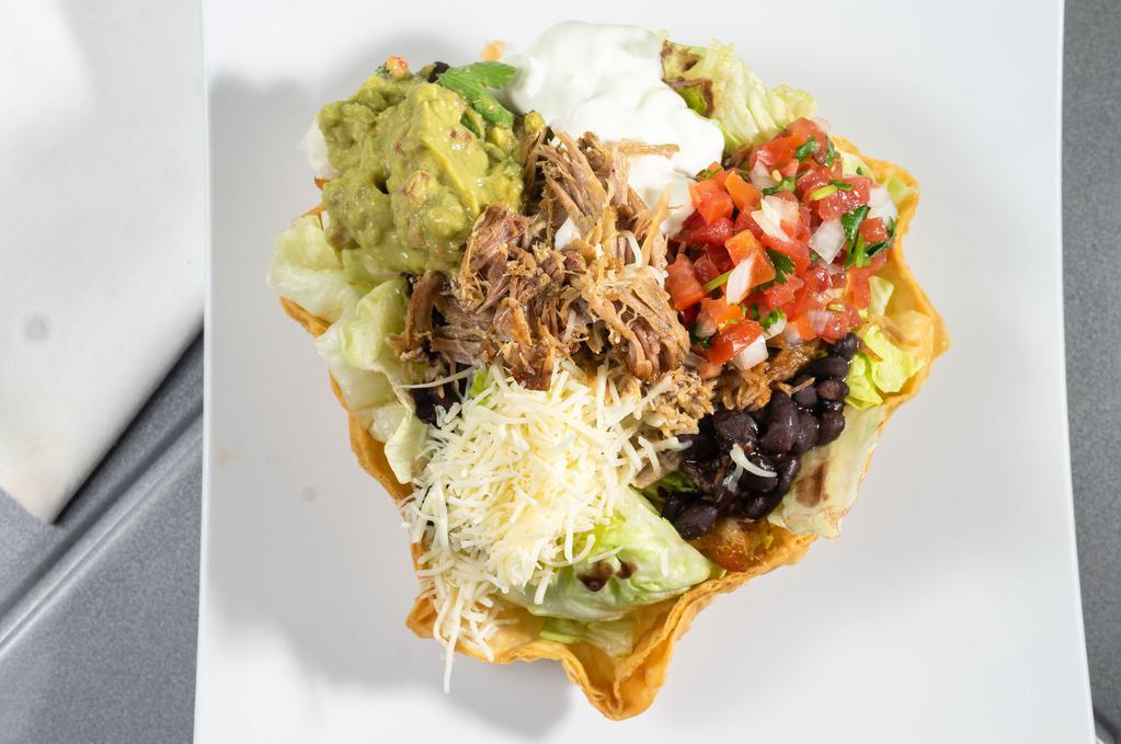 Taco Salad with Meat(Your Choice) · Served on a bed of beans, crispy tortillas, lettuce, enchilada sauce, guacamole, corn, sour cream, salsa fresca with choice of meat.