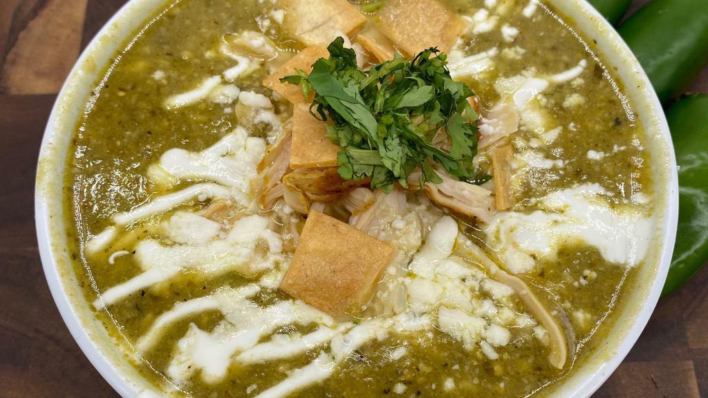 Large Green Chicken Enchilada Soup · Made with Green tomatillo base and chicken breast and topped off with Sour cream, queso fresco & Fresh Cilantro