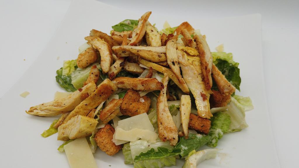 Chicken  Caesar Salad · Chopped romaine hearts, garlic croutons, shaved Parmesan cheese and caesar dressing with chicken.
