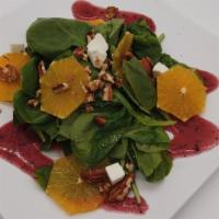 Baby Spinach Salad · Toasted pecans, mandarin oranges, roasted bacon, and feta cheese tossed with raspberry musta...