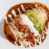 Super Burrito · Choice of meat. Served with Spanish rice, choice of beans, choice of meat, Mexican sweet cor...