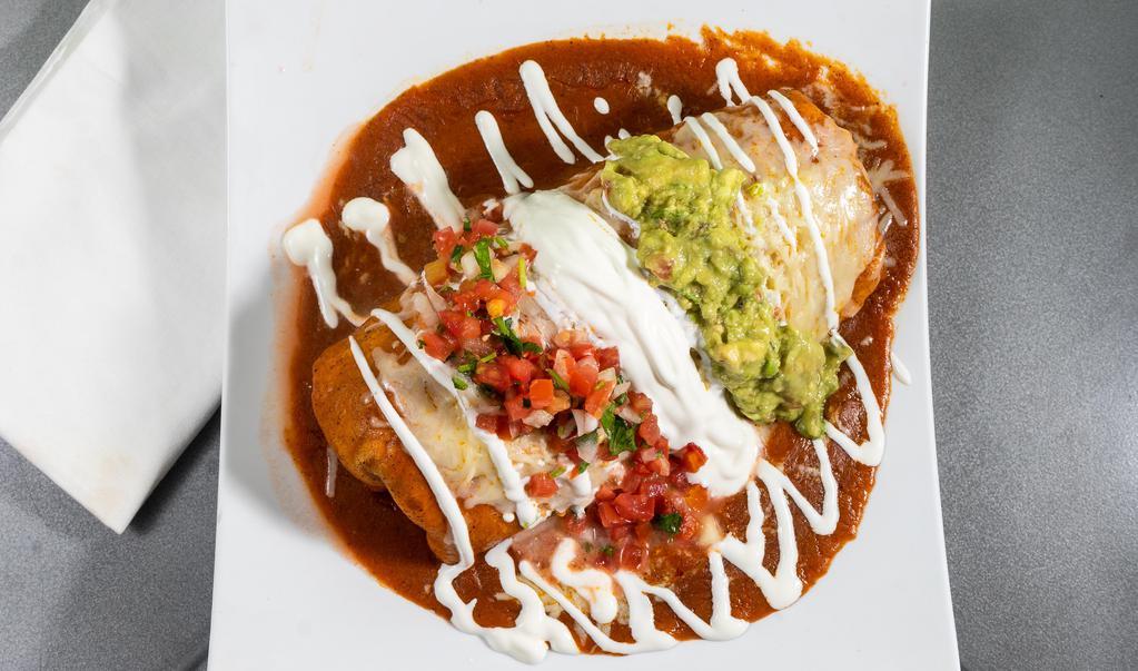 Super Burrito · Choice of meat. Served with Spanish rice, choice of beans, choice of meat, Mexican sweet corn, salsa fresca, guacamole, sour cream, and jack cheese.