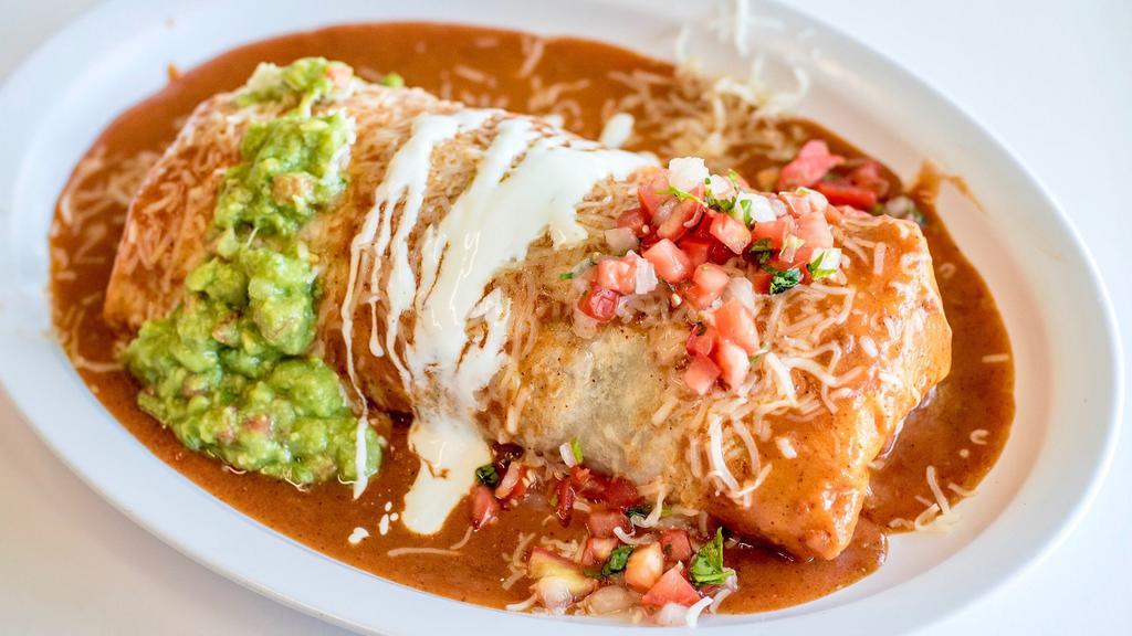 Regular Burrito · Choice of meat. Served with Spanish rice, choice of beans, choice of meat, mexican sweet corn and salsa fresca.