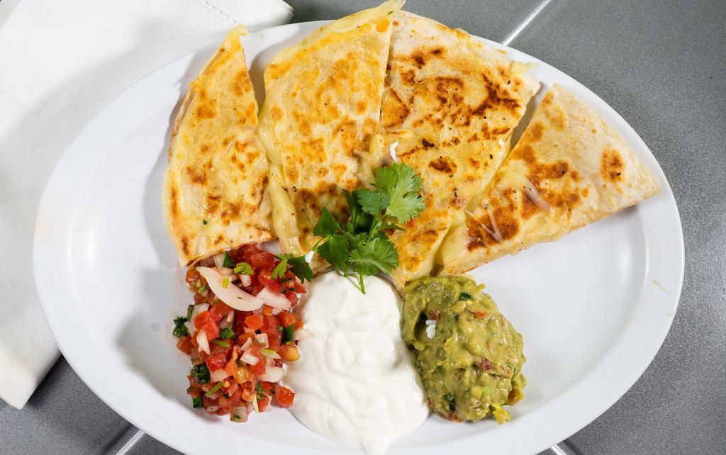 Flour Quesadilla (No Meat) · Flour tortilla with melted jack cheese, accompanied by guacamole, sour cream, and salsa fresca.