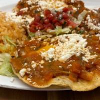 Huevos Rancheros · Two eggs cooked over corn tortillas topped with a fire-roasted tomato sauce.