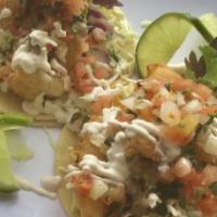 2 Baja Style  Fish Tacos · Beer Battered “FRIED COD”  Shredded Cabbage topped off with Baja Mayonaise Sauce,, Salsa Fre...