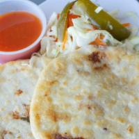 Pupusa Pork and Cheese · Homemade Pupusa with pork and Cheese served with Curtido & Tomato Sauce