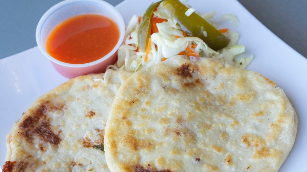 Pupusa Pork and Cheese · Homemade Pupusa with pork and Cheese served with Curtido & Tomato Sauce