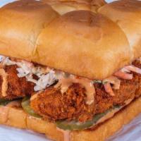 The Hot Chick · Nashville style fried chicken tenders, pickles, secret sauce and haus slaw; served on King's...