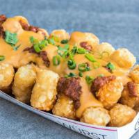 Chili Cheese Tots · tots, cheddar cheese sauce, haus chili, green onions