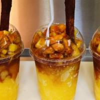 Mangonada · Ingredients: blended mango with ice, fresh mango on top with chamoy, tajin  and lemon.