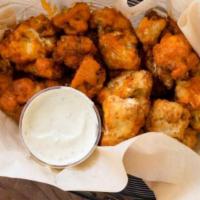 Cauliflower Wings · Choose your sauce, comes with housemade ranch.