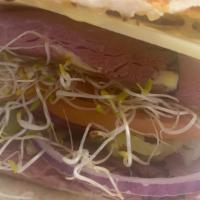 10. Belly Buster · Double pastrami, swiss cheese, greek peppers, tomato, red onion,  sprouts, mayonnaise and mu...