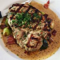 Pork Chop · Brussels sprouts, bacon, apple cider mustard sauce.