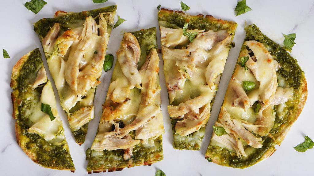 Chicken Pesto · Our classic flatbread brushed with basil pesto sauce and loaded with chicken, mozzarella and ricotta.