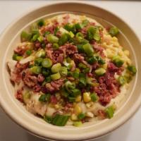 2. Bowl Named Sue · Southern mashed potatoes, chicken, white gravy, corn, bacon, green onions.
