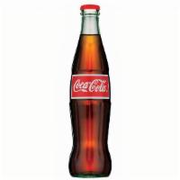 Mexican Coca-Cola · 1L Mexican Coke contains: Carbonated water, cane sugar, caramel color, phosphoric acid, natu...