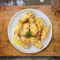 Fuzzy Garlic Parmesan Wings · Fresh chicken wings breaded, fried until golden brown, and tossed in garlic and parmesan. Se...