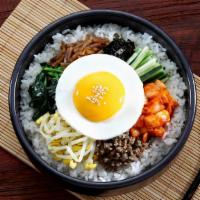 Bibimbop · A bed of rice topped with choice of protein, assorted veg and a fried egg.