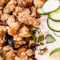 Thai Pop · Popcorn chicken tossed with fried Thai Basil. Served with rice and fried onions-garlic garni...