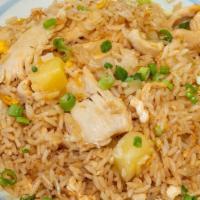 Pineapple Fried Rice · Wok-tossed fried rice with pineapple, chicken, egg, scallions and onions.