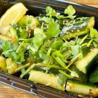 Spicy Cucumber Salad · Persian cucumbers, sesame seeds, chili flakes, soy based vinaigrette.