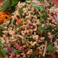 L Larb Chicken · Meat in roasted rice powder, chili and spicy lime sauce with a touch of fresh mint and onions.