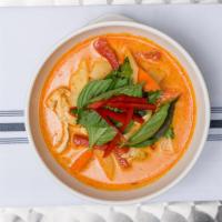 14. Red Curry · With bamboo shoots. Meal comes medium spicy.