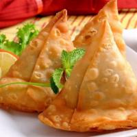 Samosa Plate · Fried Snack filled with potatoes and secret spices. Served with tamarind and mint sauce.