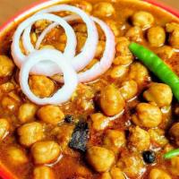 Chana Masala · Chick Beans made with Indian Spices, garnished with cilantro.