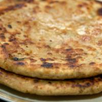Aloo Paratha · Bread stuffed with potato and spices. Served with yogurt.