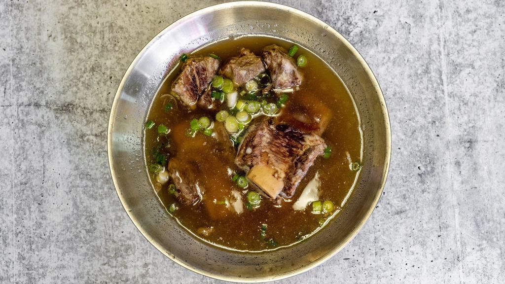 Beef Short Rib Soup (갈비탕) · Beef Short Ribs with green onion, glass noodle in clear broth.