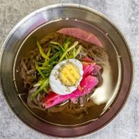 Cold Noodle / 물냉면 · Korean style cold noodle dish with chopped pickled radish and boiled egg on top.