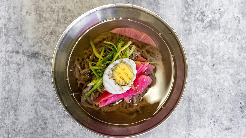Cold Noodle / 물냉면 · Korean style cold noodle dish with chopped pickled radish and boiled egg on top.