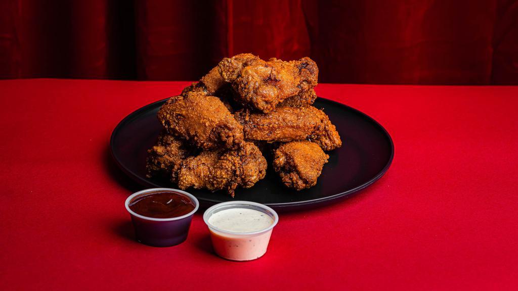 Twelve Hot  Wings · Choice of two different spice levels, choice of two sauces, and side of pickles