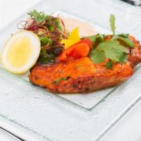 Tandoori Fish · Marinated slices of fish cooked in a clay oven.