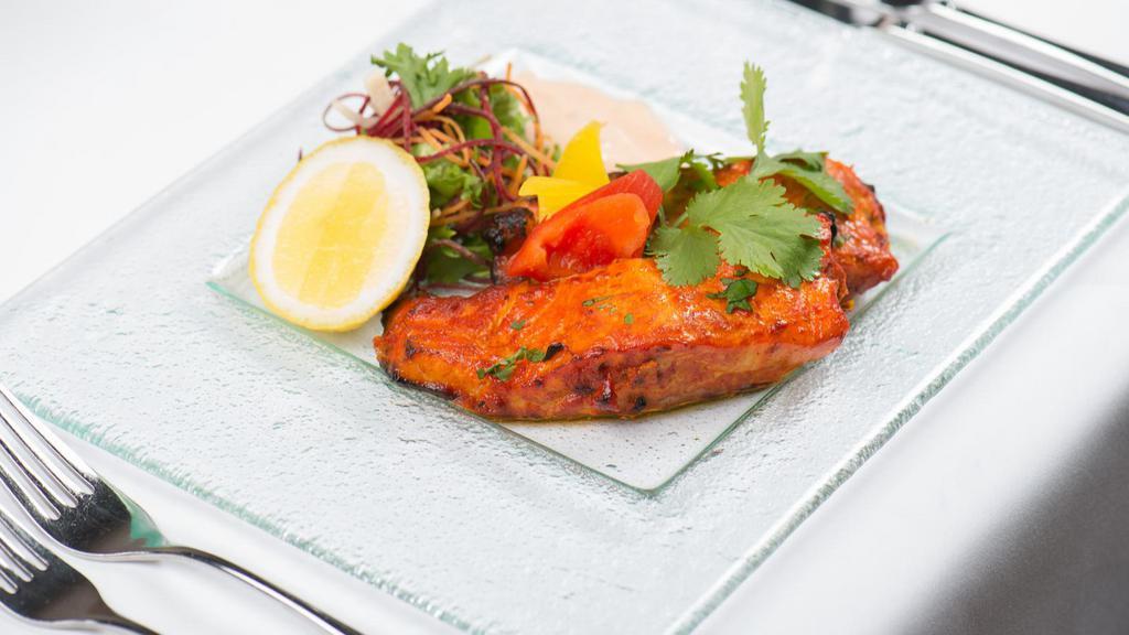 Tandoori Fish · Marinated slices of fish cooked in a clay oven.