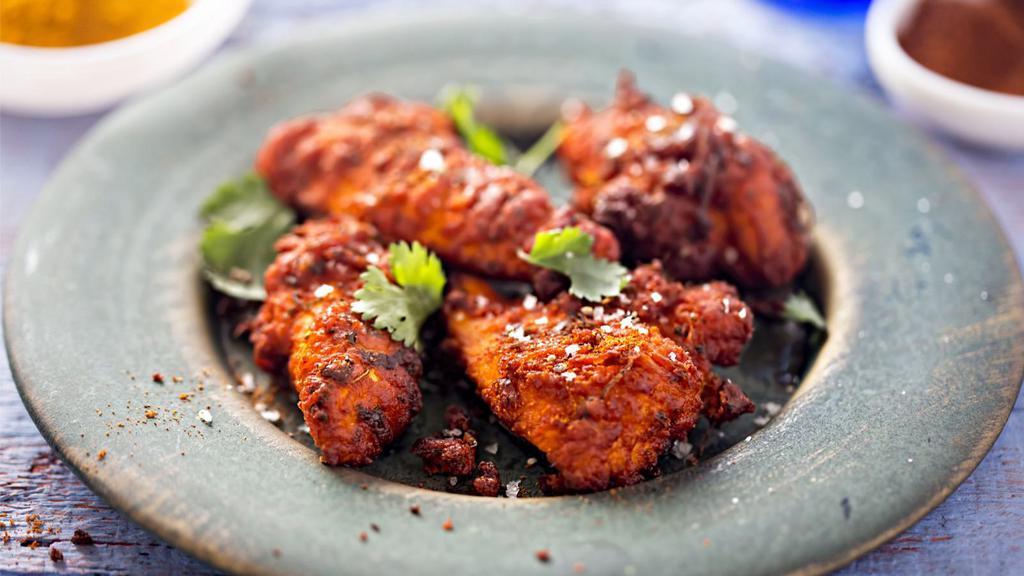 Chicken Tandoori Breast · Chicken marinated in yogurt and special spices, cooked on skewers in a clay oven.