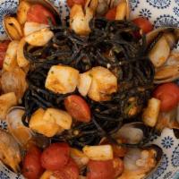 Marechiaro · Homemade squid ink tagliolini, jumbo scallops, clams, roasted garlic, in light spicy tomato ...