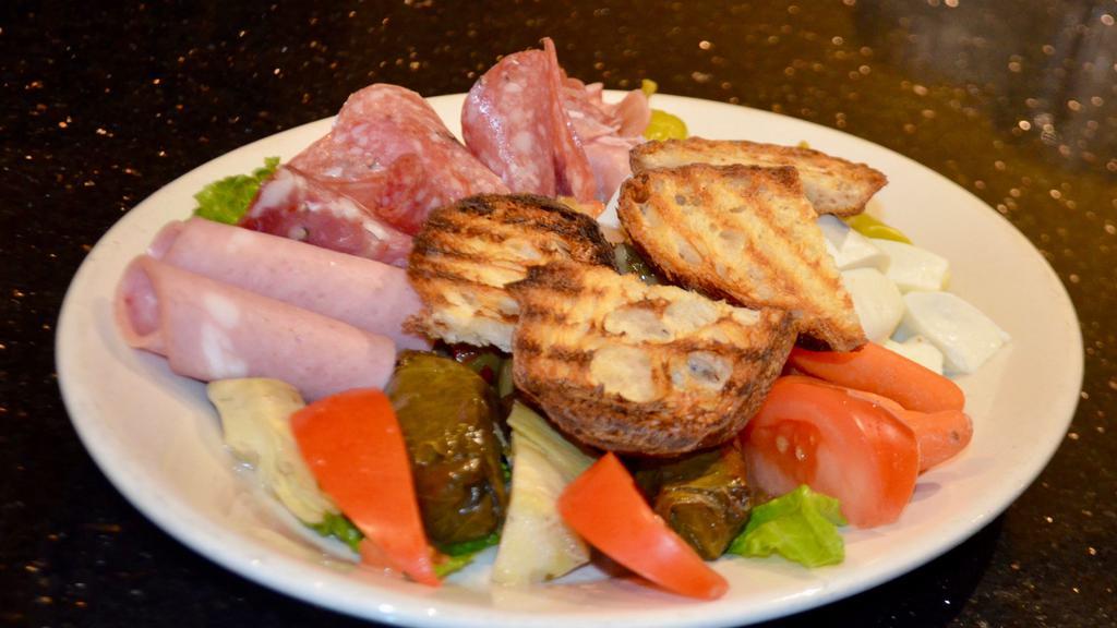 Antipasto · Assortment of meats, mozzarella, olives, & vegetables.