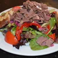 Beef Salad · Thinly sliced beef served over mixed greens tossed in an Asian dressing with crispy noodles,...