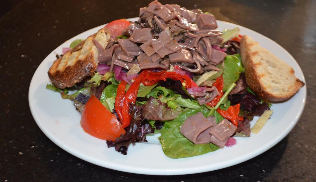 Beef Salad · Thinly sliced beef served over mixed greens tossed in an Asian dressing with crispy noodles, onion, red pepper.