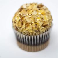Burnt Almond · Marble cupcake with vanilla custard and roasted almonds on top.
