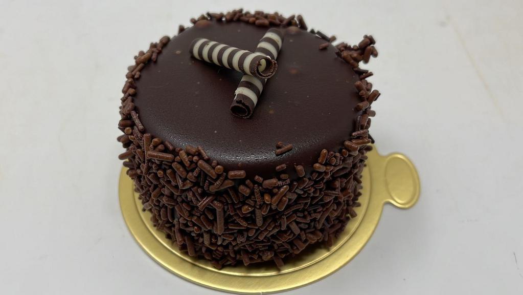 Chocolate Mousse · Layers of vanilla chiffon cake and chocolate mousse, dipped in chocolate ganache and chocolate sprinkles. Comes in a round shape (varies from picture).

All items are kept in a freezer and come frozen.