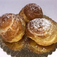Cream Puff · Pate choux filled with vanilla whipped cream, topped with powdered sugar.

All items are kep...
